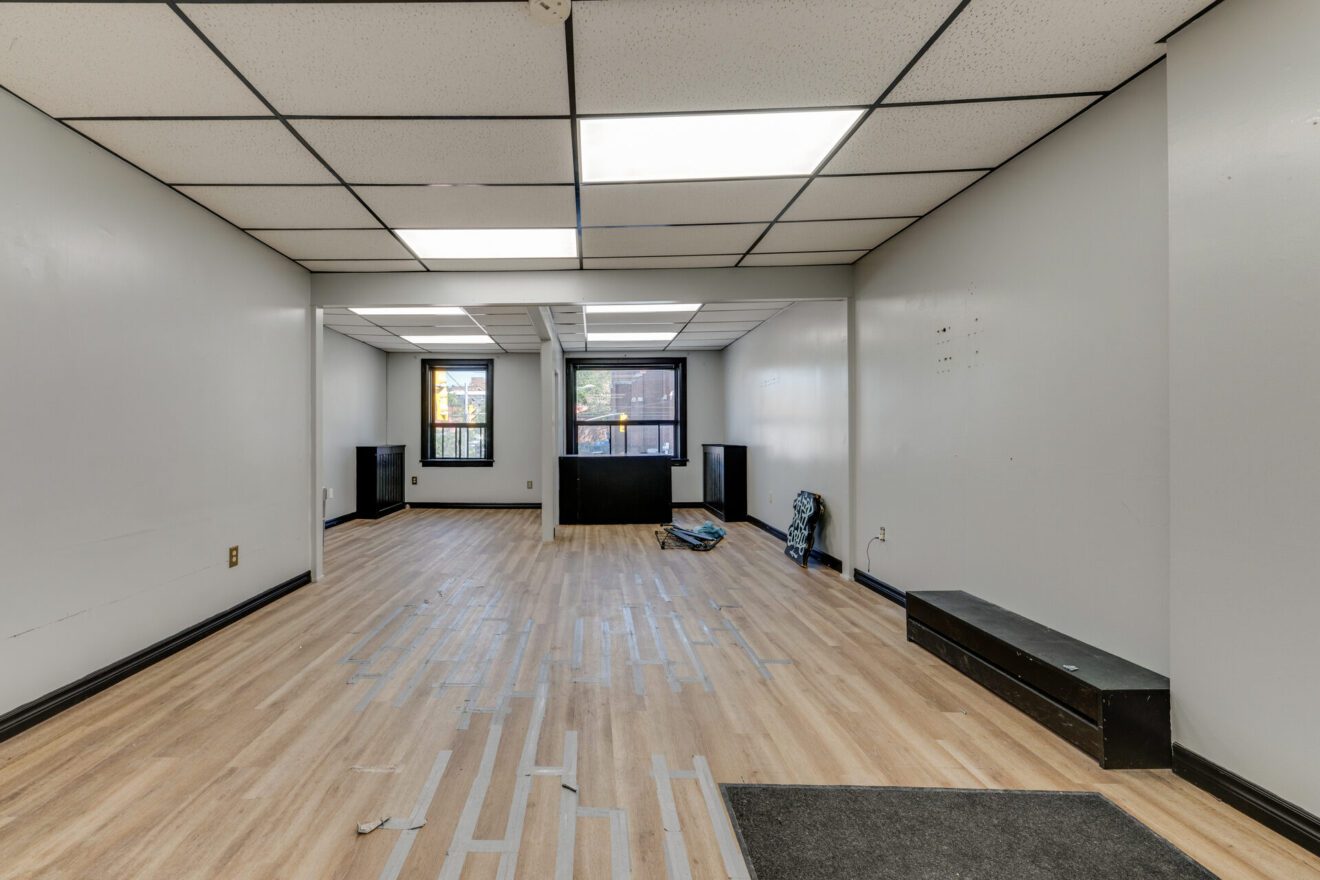 Open second-floor commercial space at 539 St Clair Ave W looking toward the windows