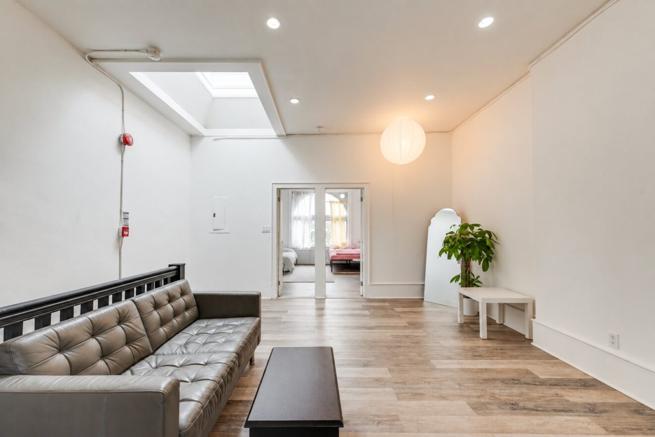 Living room in a two-bedroom residential suite, 1378 Queen Street West