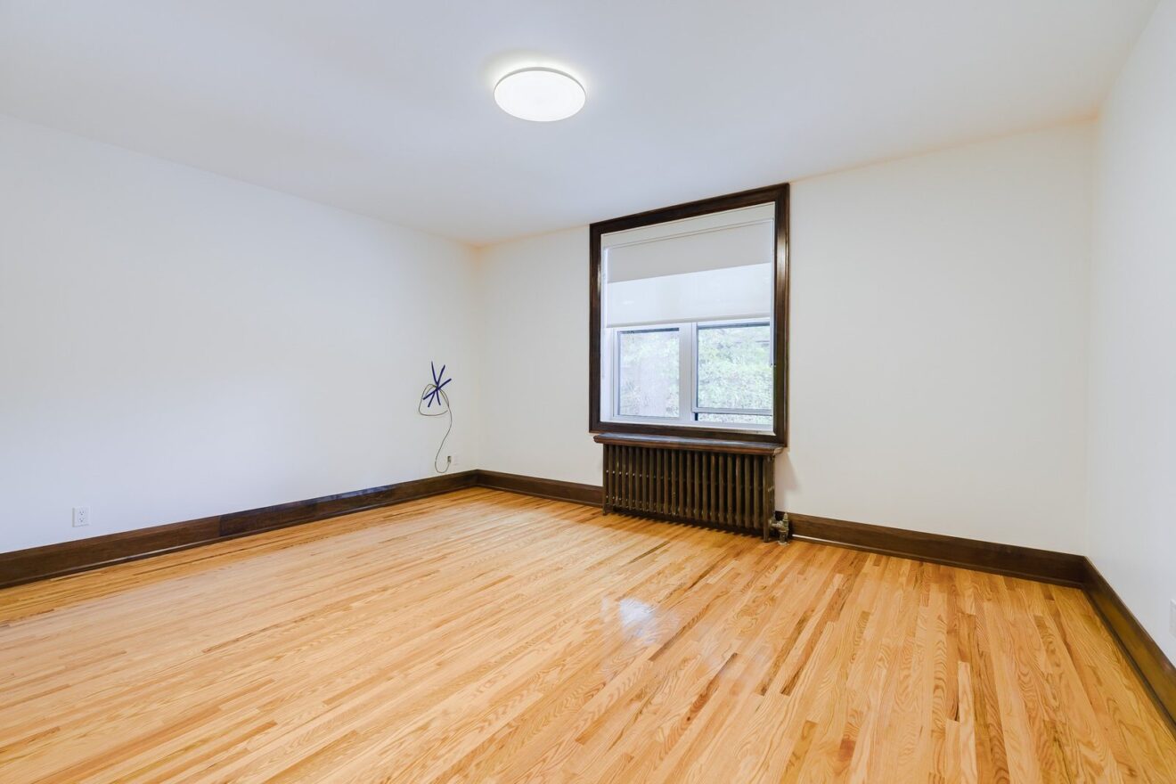 Two bedroom apartment living room with hardwood floors